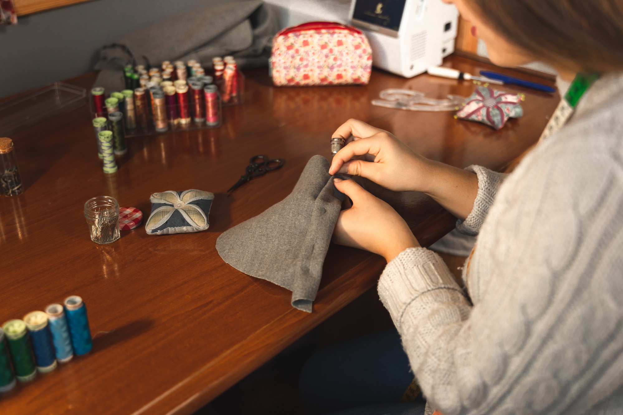 Workshop table with threads and embroidery sample