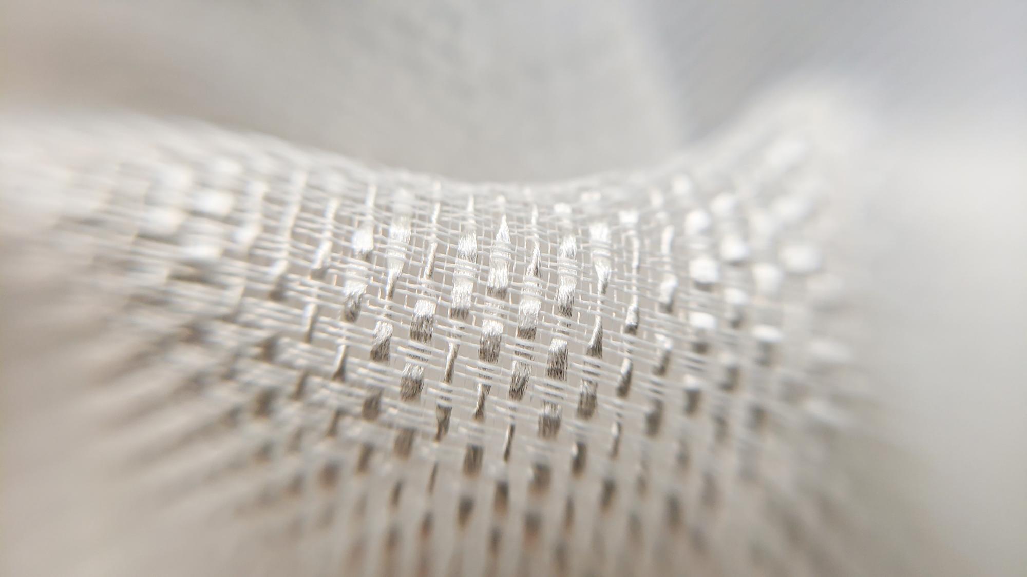 Close-up of modern embroidery on technical fabric